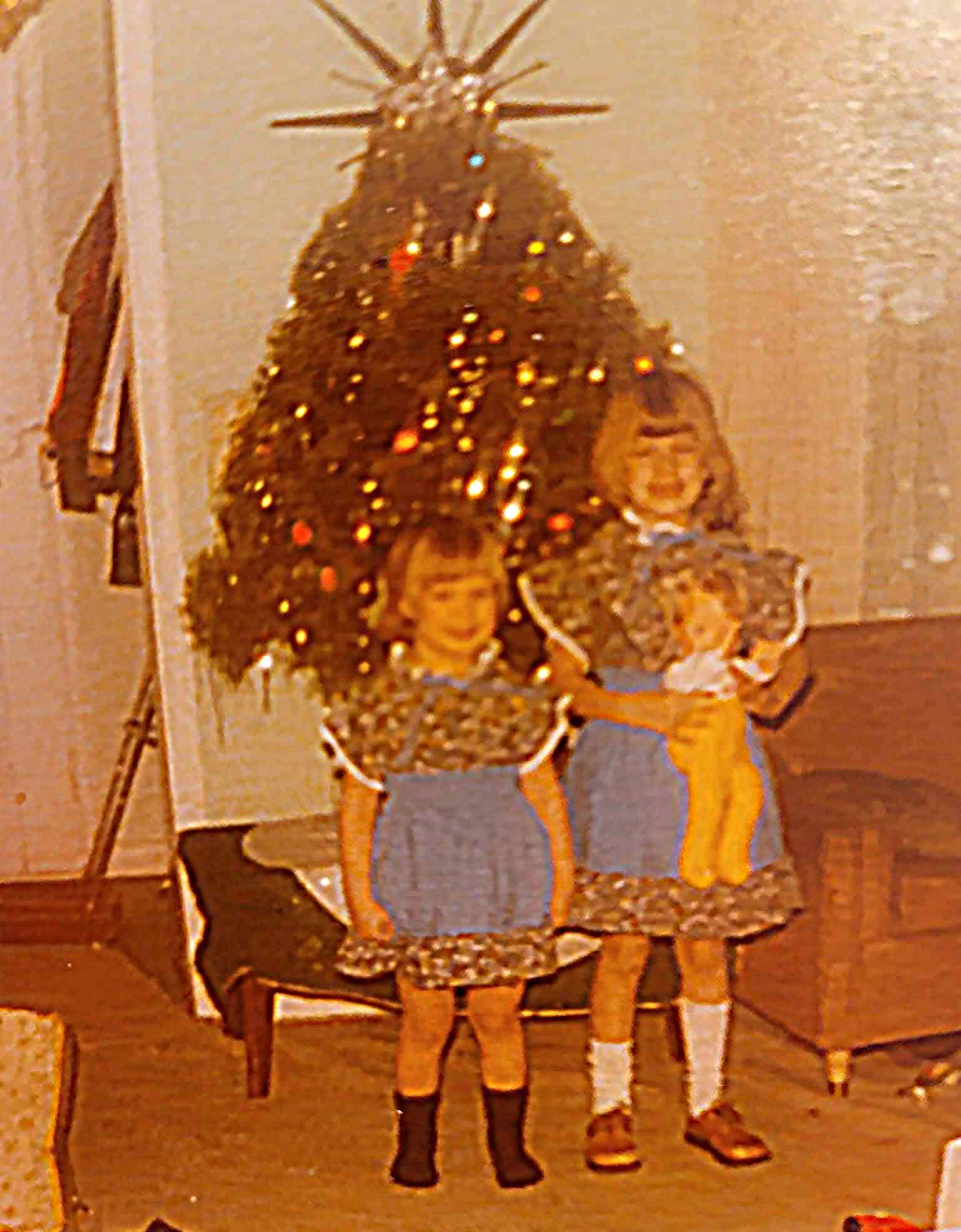 Vintage Christmas photo with Rachelle and Becky (the "BoatHouse Girls"), and decorated tree, capturing holiday nostalgia and family moments.